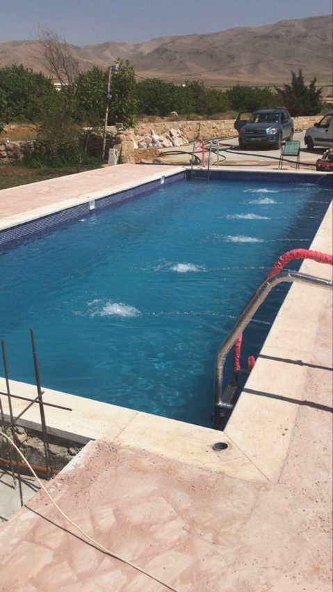 Outdoor swimming pool showing water circulation jets