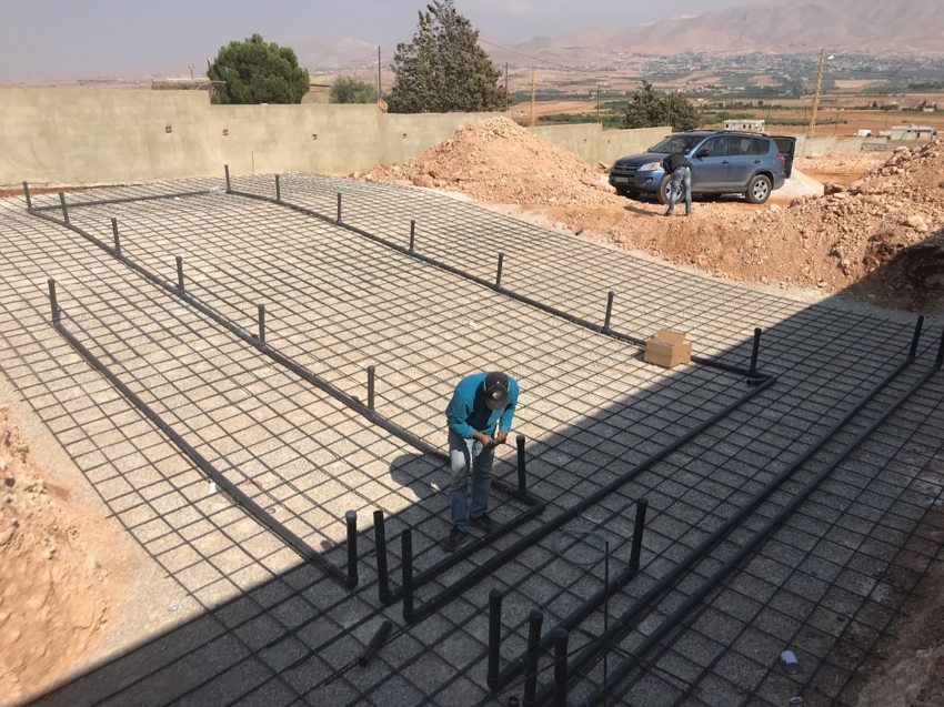 Pool floor reinforcement and plumbing during installation
